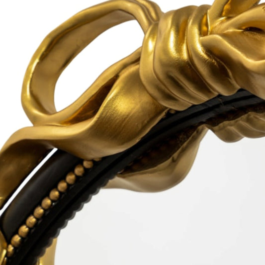 Close-up of a gold and black decorative item with intricate design