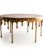 Bronze coffee table with a unique design on a white background
