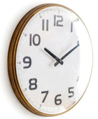 Wall clock with a white face and black numbers on a white background
