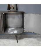 Metallic sideboard with corrugated metal doors on a gray carpeted floor.