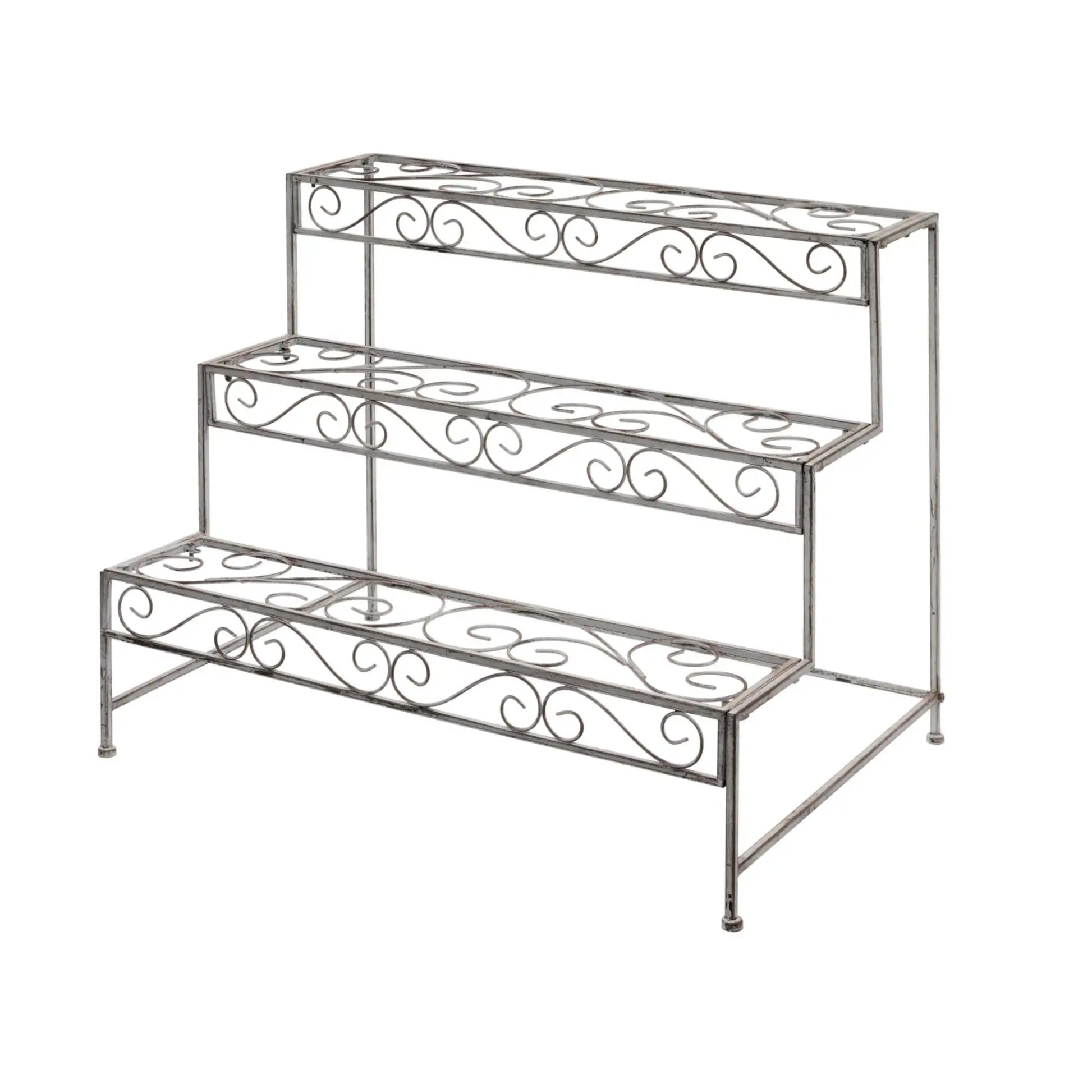 Wrought iron plant stand with decorative scrollwork on a white background