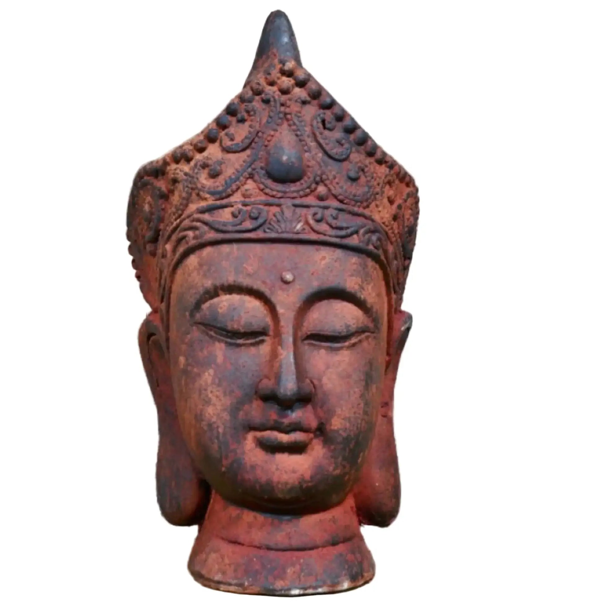 Decorative Buddha head sculpture against a stone wall background