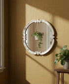 Decorative metal ring with intricate design on a white background