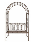 A dark brown wrought iron garden bench framed by an arched trellis with decorative scrollwork, shown against a plain white background.