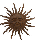 Decorative sun wall art with a face on a white background