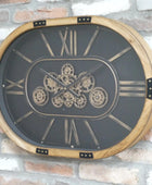 Decorative wall clock with gear design on a brick wall