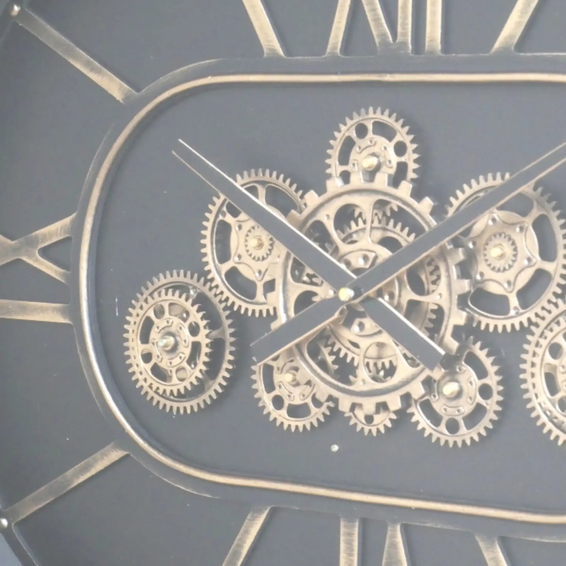 Close-up of a clock with visible gears and Roman numerals on a dark background