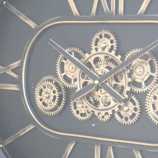 Close-up of a clock with visible gears and Roman numerals on a dark background
