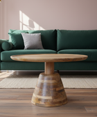 Wooden coffee table in front of a green sofa in a living room setting