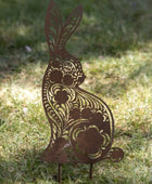 Decorative metal rabbit sculpture on grass