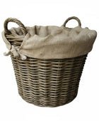 Wicker laundry basket with a hessian liner on a white background