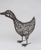 Wire sculpture of a duck on a white background