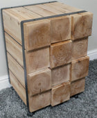 Wooden cube-shaped side table with metal frame on a gray carpet