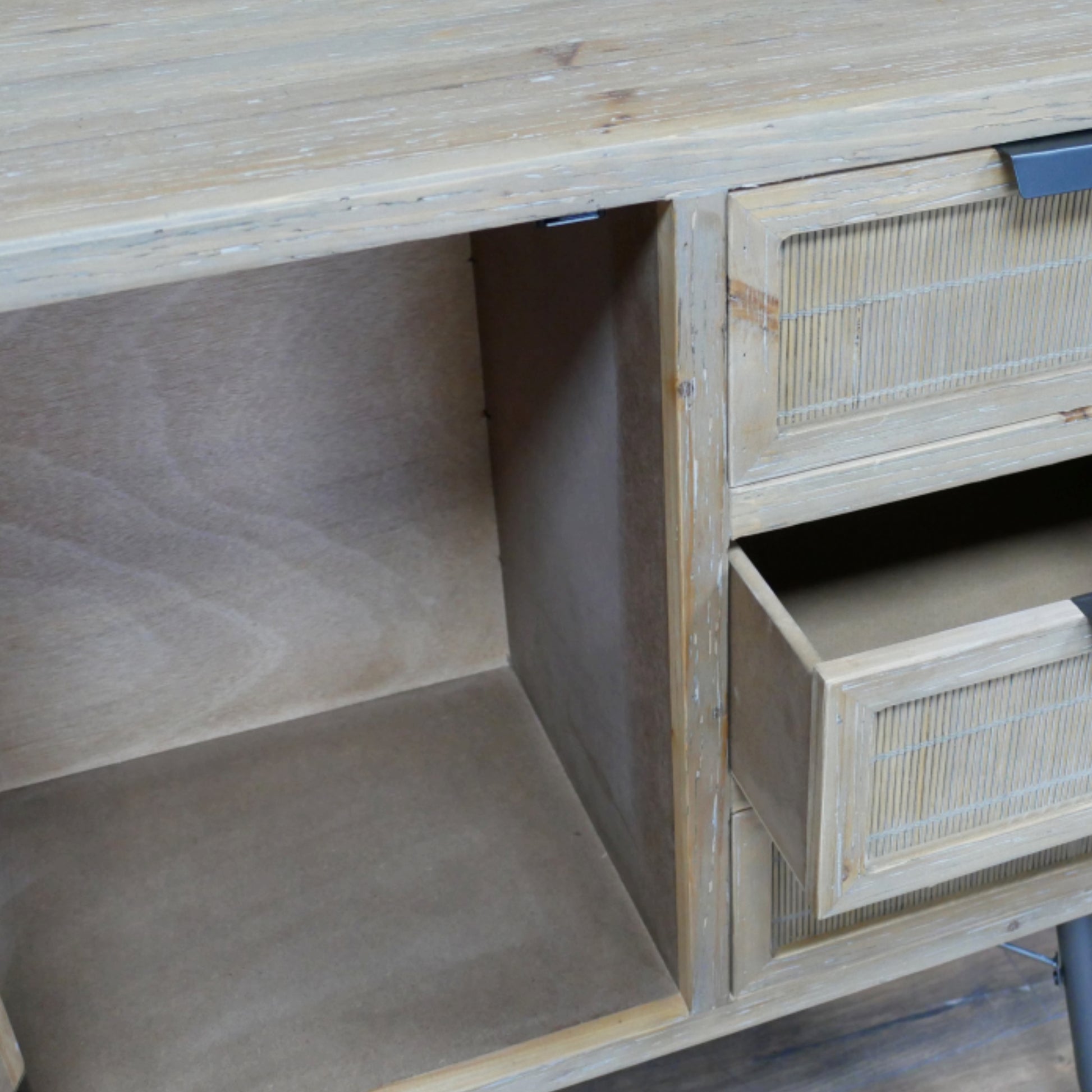 Wooden desk with open drawer and shelf