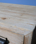 Wooden box with a metal handle on a blue background