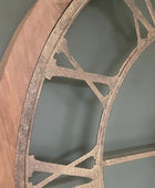 Decorative wall shelf with wooden edge and metal lattice design against a gray background