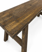 A rustic dark brown wooden table with a thick plank top and sturdy trestle-style legs, shown on a clean white background.