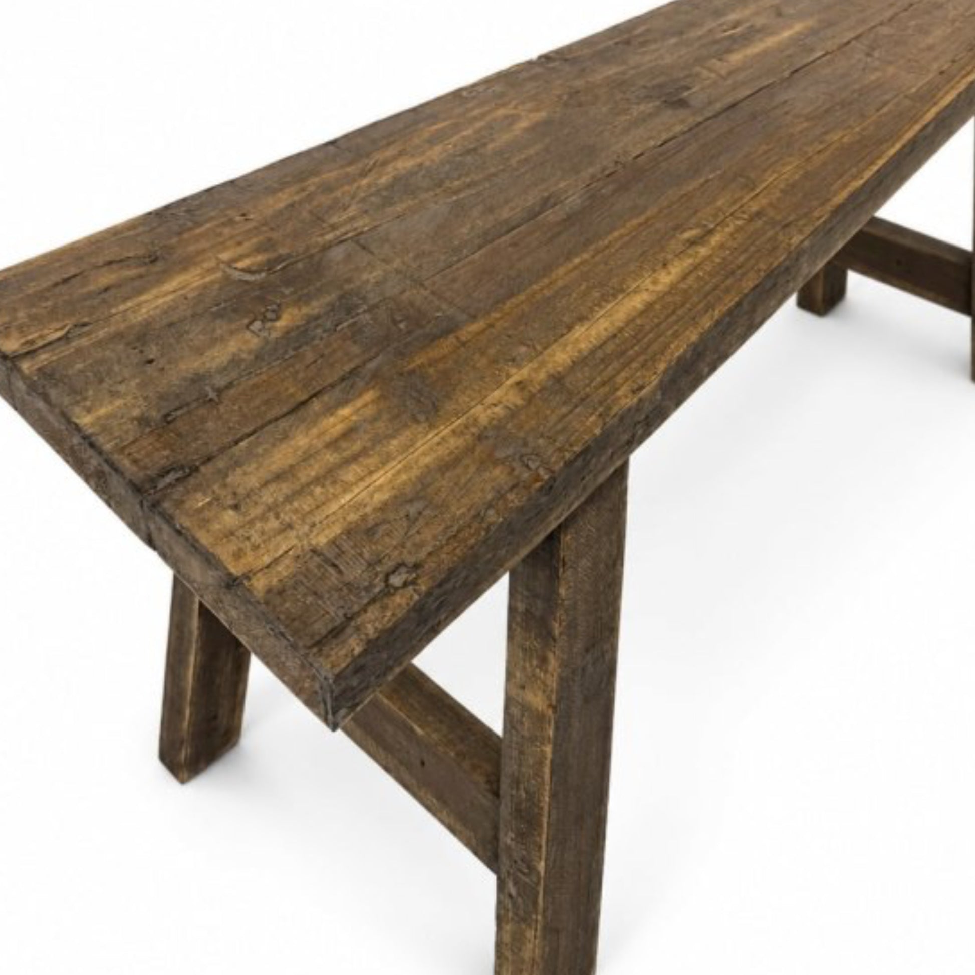 A rustic dark brown wooden table with a thick plank top and sturdy trestle-style legs, shown on a clean white background.
