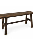 A rustic dark brown wooden bench with a thick plank seat and trestle-style legs, shown on a plain white background.