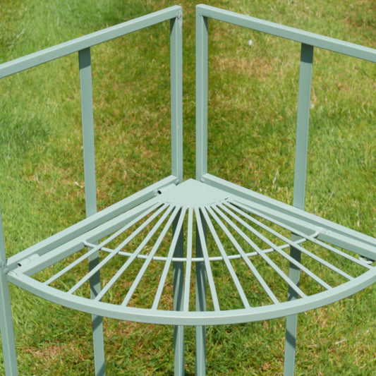 Light blue metal corner chair on a grassy background