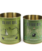 Two olive oil tins with a vintage-style green and gold design, one labeled 'OLIVE OIL WITH BASIL' and the other showing a small bottle of olive oil inside, set against a plain white background.