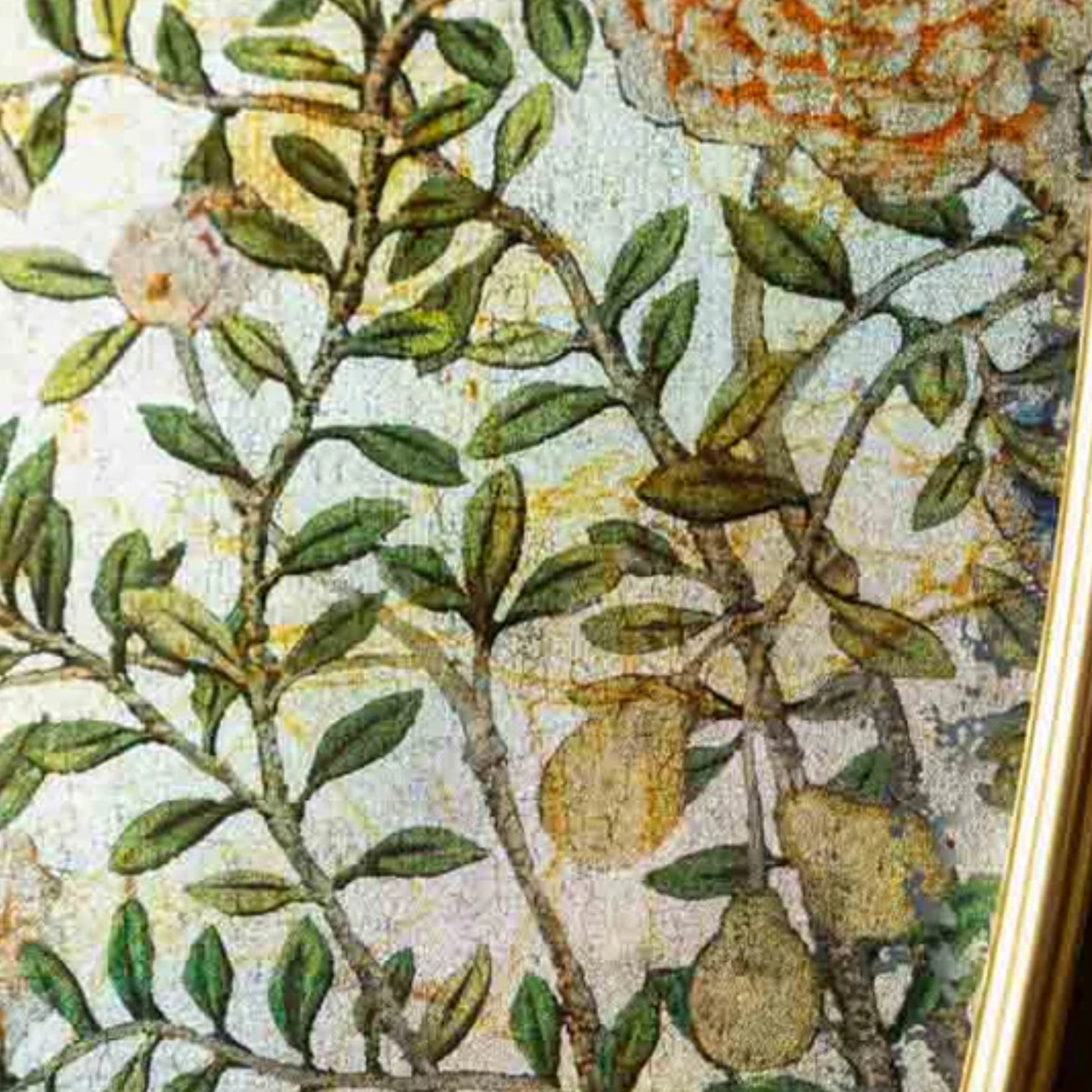 Close-up of a floral pattern with green leaves and brown branches on a textured background.