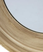 Close-up of a wooden circular object with a glass center on a white background