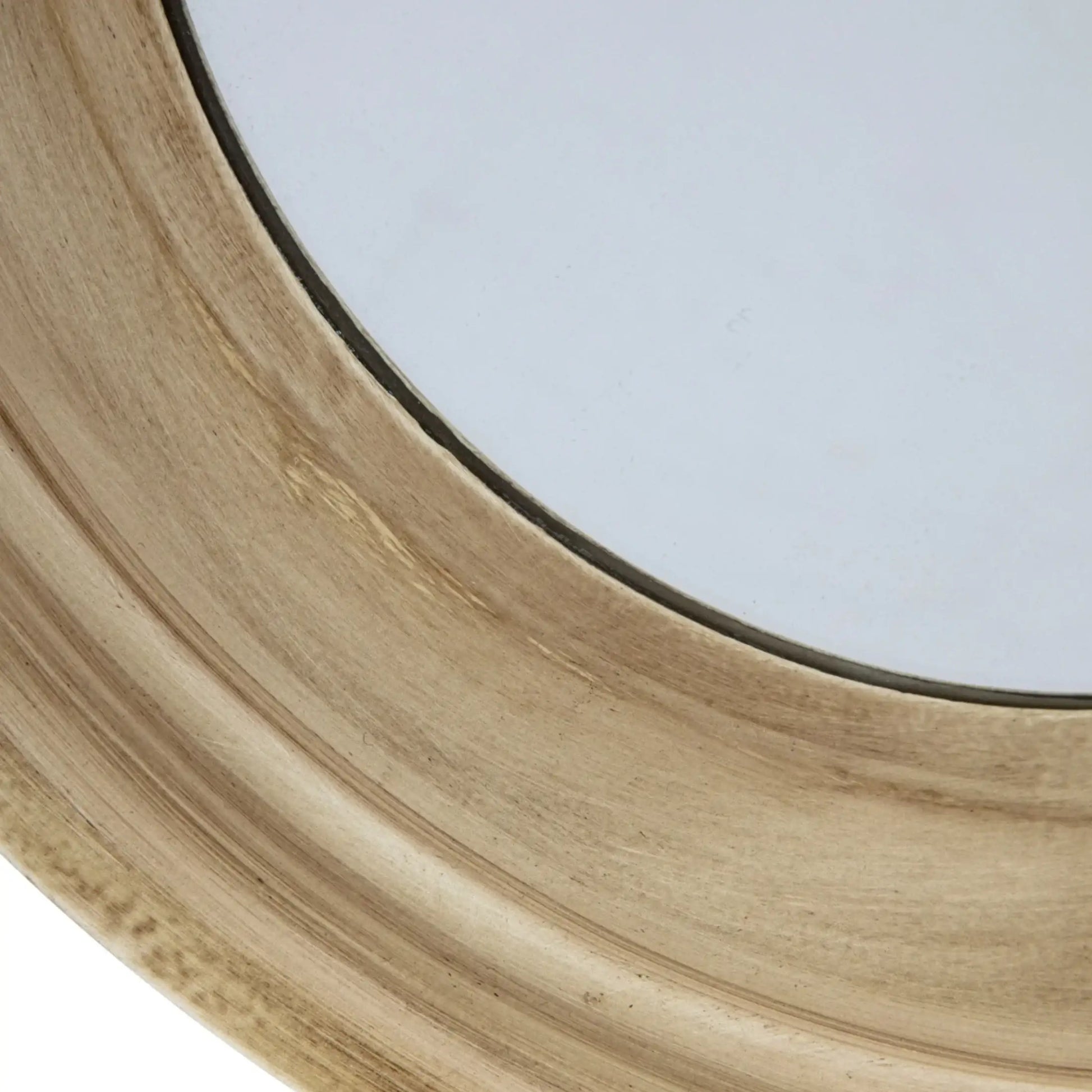 Close-up of a wooden circular object with a glass center on a white background