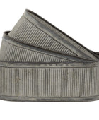 Metallic ribbed belt on a white background