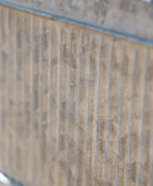 Close-up of a textured wall with horizontal lines and a blue border.