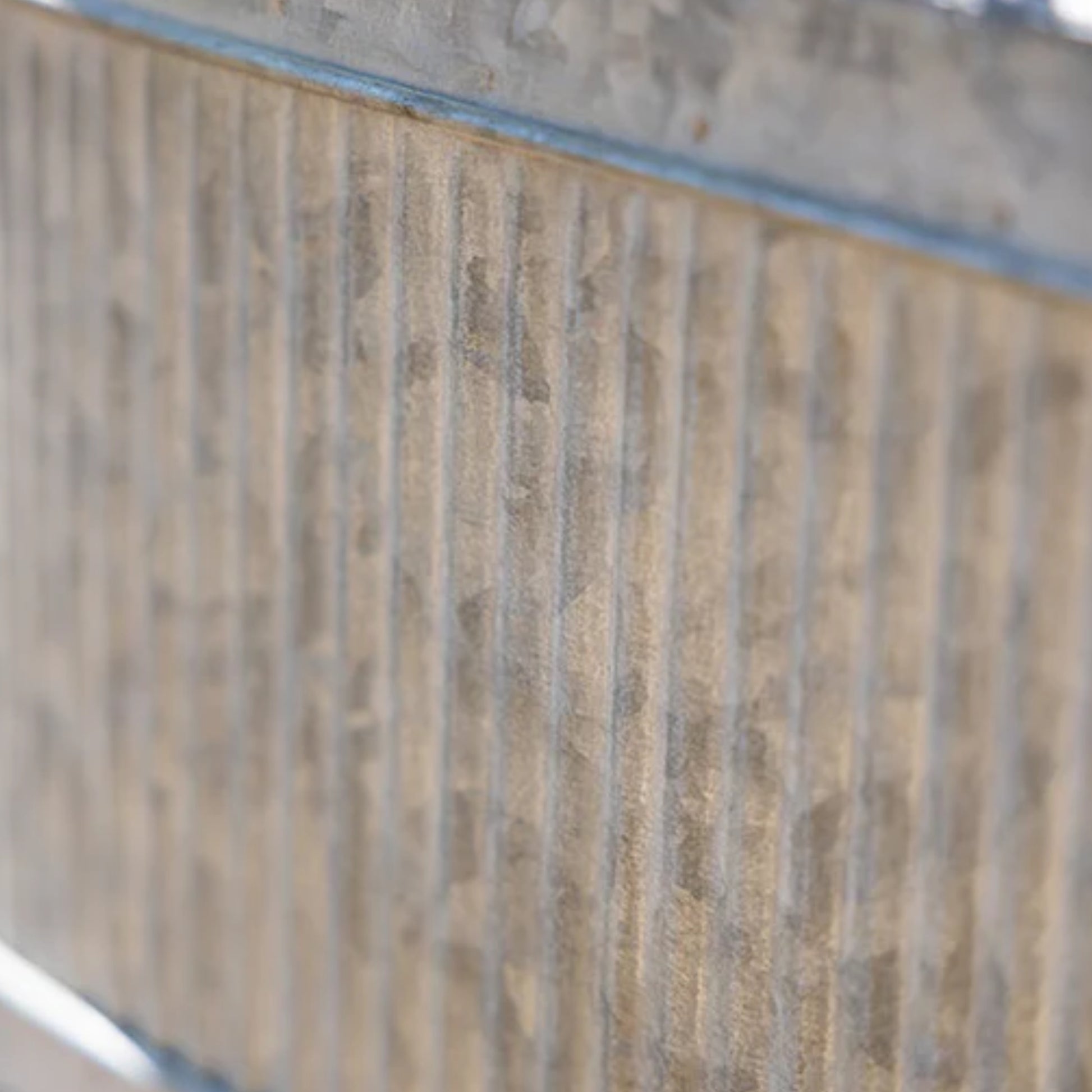 Close-up of a textured wall with horizontal lines and a blue border.
