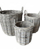Three wicker baskets of different sizes on a white background