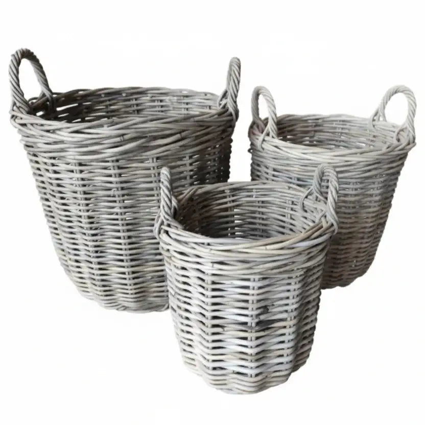 Three wicker baskets of different sizes on a white background