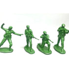 Four green toy soldiers on a white background