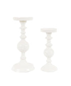 Two white candle holders on a white background