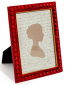 Red decorative frame with a silhouette and text on a white background