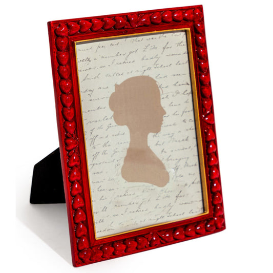 Red decorative frame with a silhouette and text on a white background