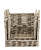 Wicker basket with handles on a white background