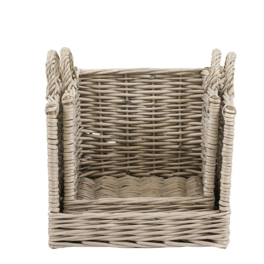 Wicker basket with handles on a white background