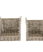 Two wicker baskets on a white background