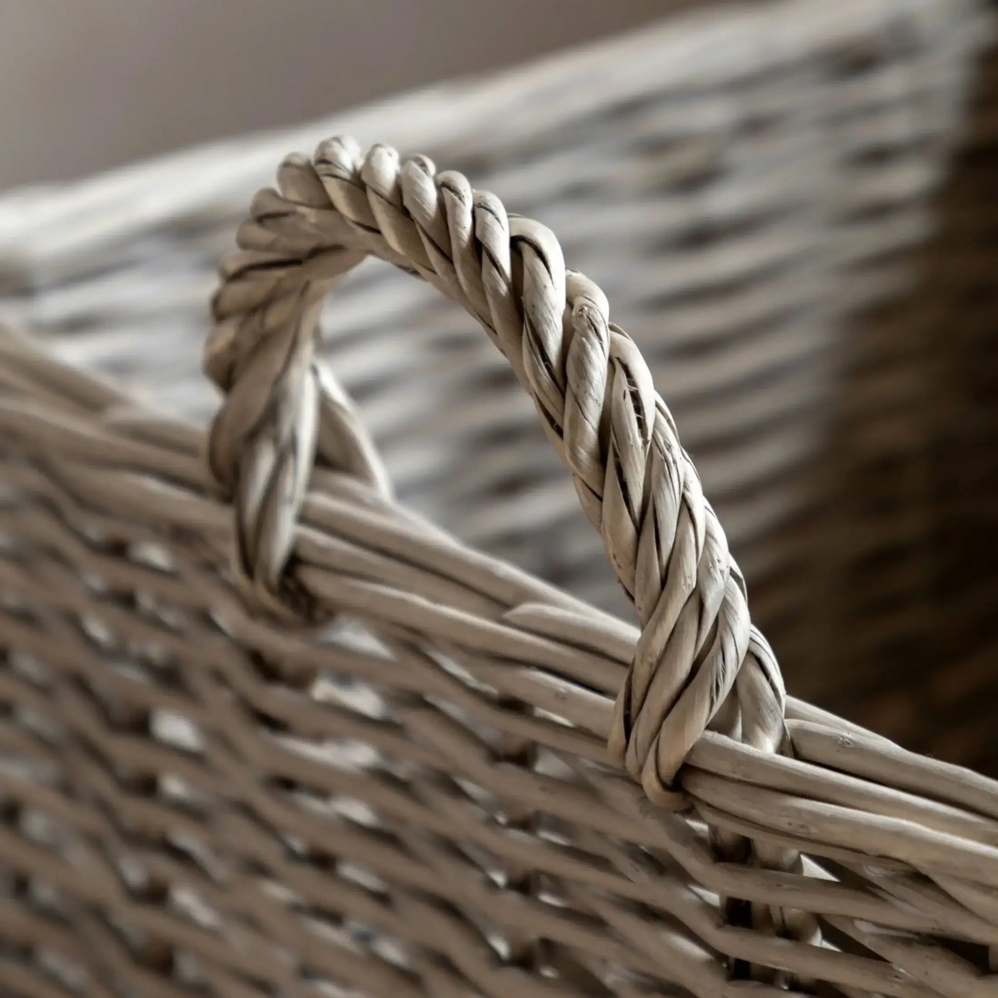 Close-up of a woven basket with a braided handle.