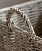 Close-up of a woven basket with a braided handle.