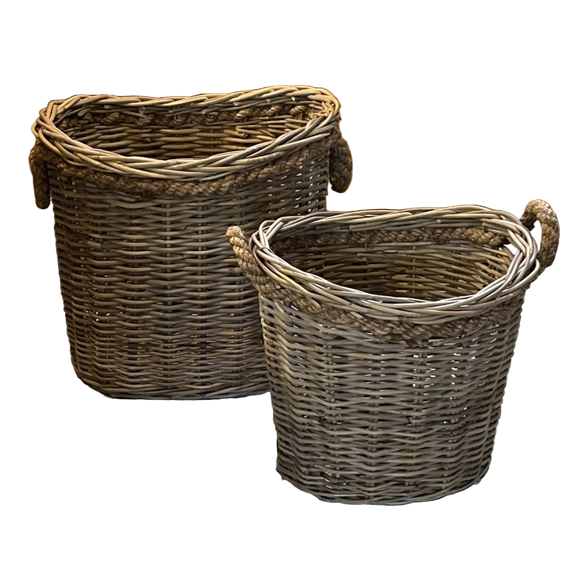 Two wicker baskets with handles on a white background