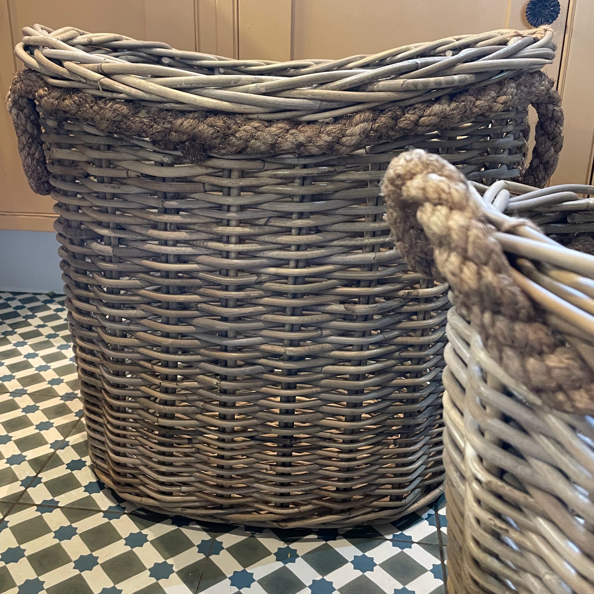 Wicker laundry basket on a patterned floor