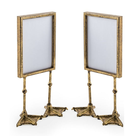 Two gold-framed stands with white backgrounds on a white background