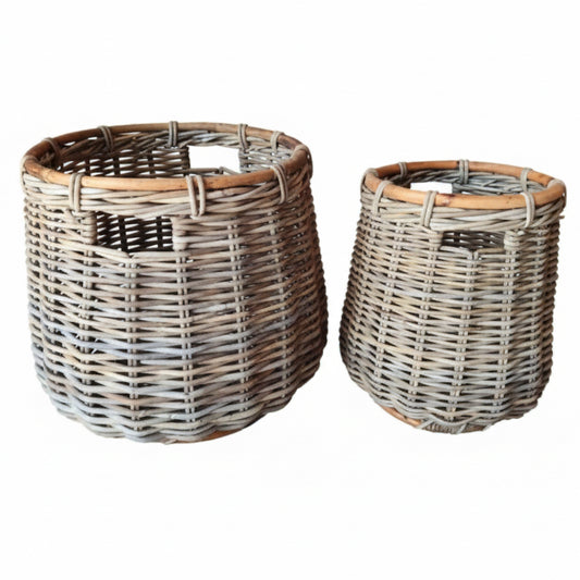 Two wicker baskets on a white background