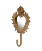 An ornate gold wall hook shaped like a heart, featuring a decorative floral crown at the top and a sunburst frame, shown against a plain white background.