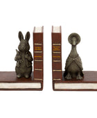 A pair of decorative bookends shaped like old book spines, with a small rabbit figurine on the left and a duck figurine on the right, both mounted on brown faux-leather bases against a plain white background.