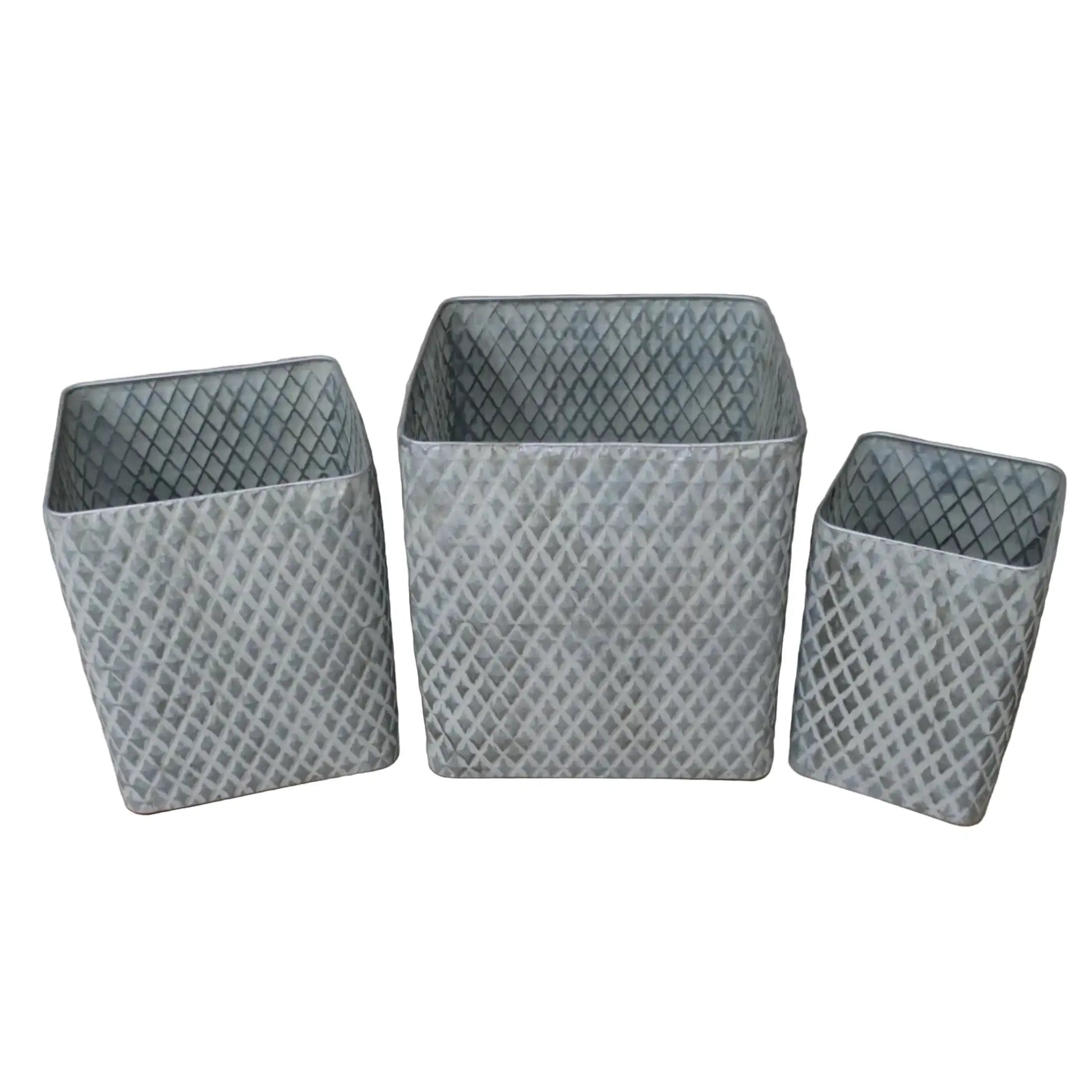 Three gray woven baskets of different sizes on a wooden surface with a neutral background
