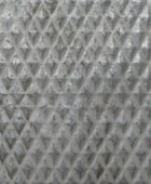 Close-up of a textured gray material with a diamond pattern
